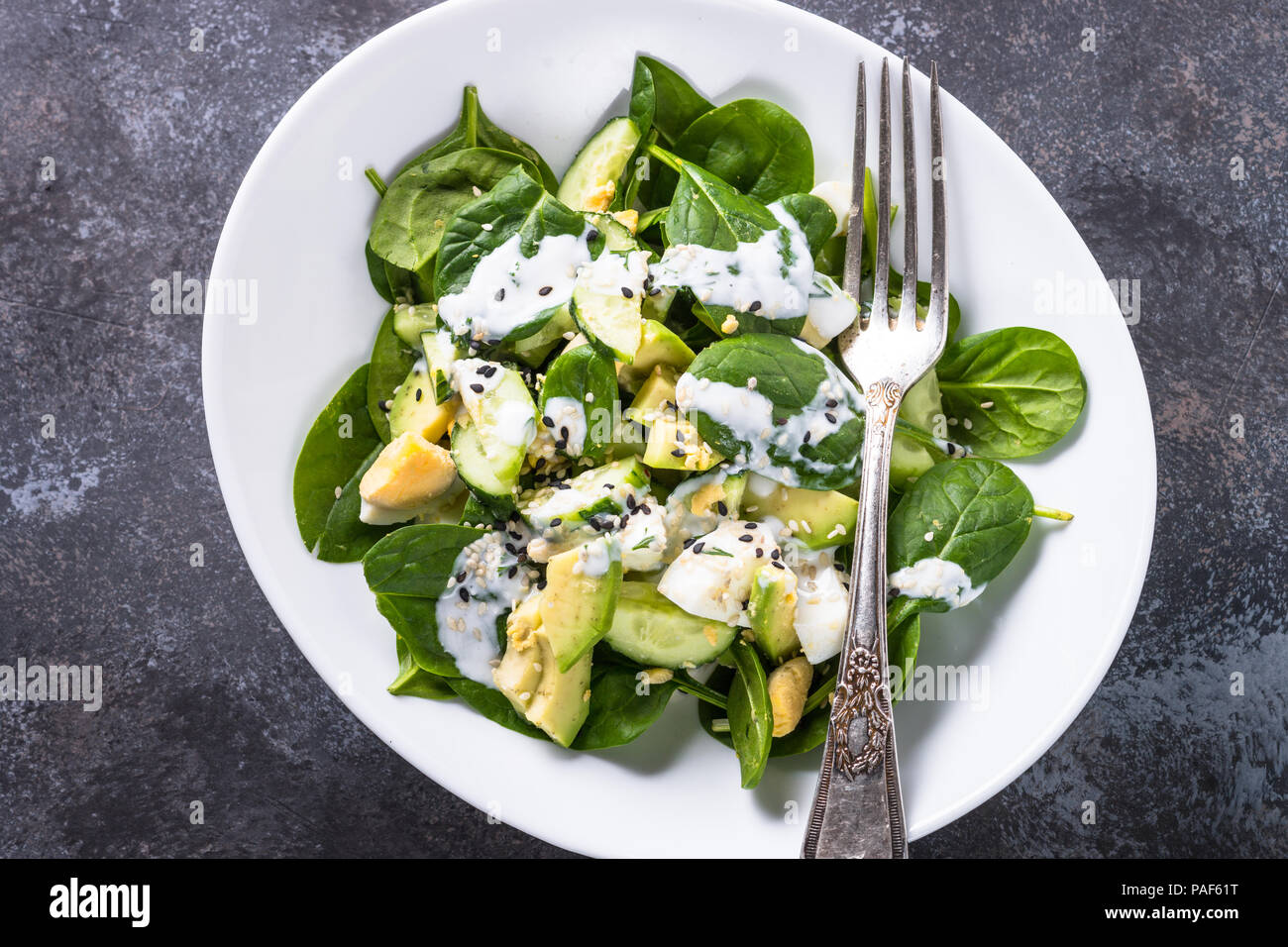 Green salad with avocado, spinach egg and cucumber Stock Photo - Alamy