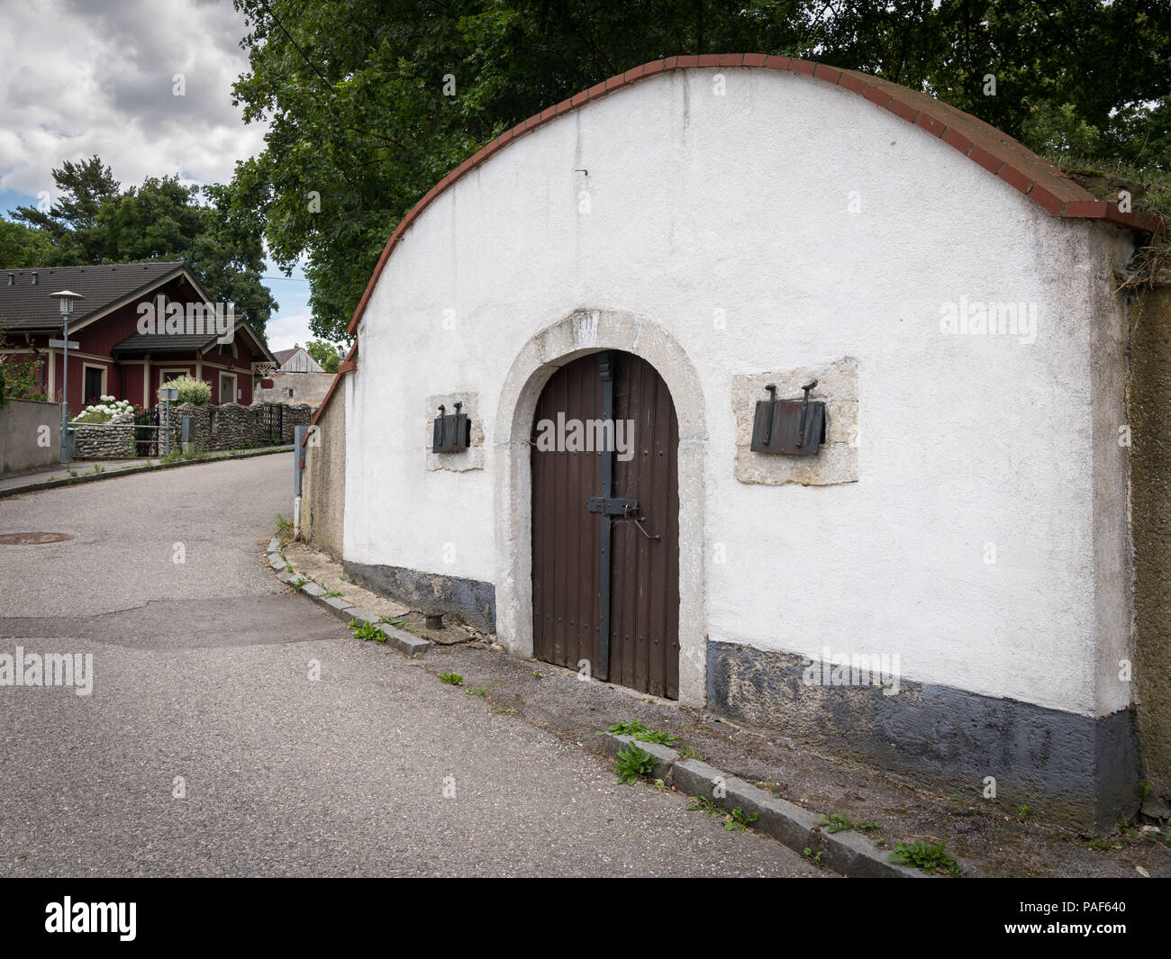 Entrance of a traditional wine cellar in Lower Austria, door and ventilation hole, initials of