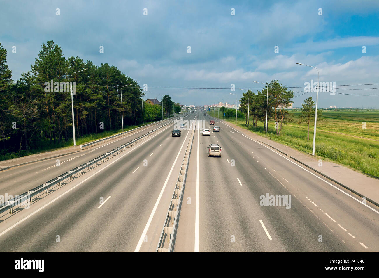 Two Lane Freeway With One Way Traffic In Front Of The City Stock Photo Alamy
