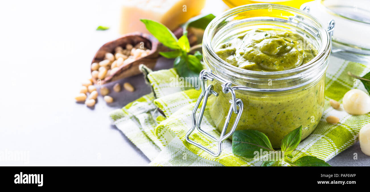 Pesto sauce in glass jar Stock Photo Alamy