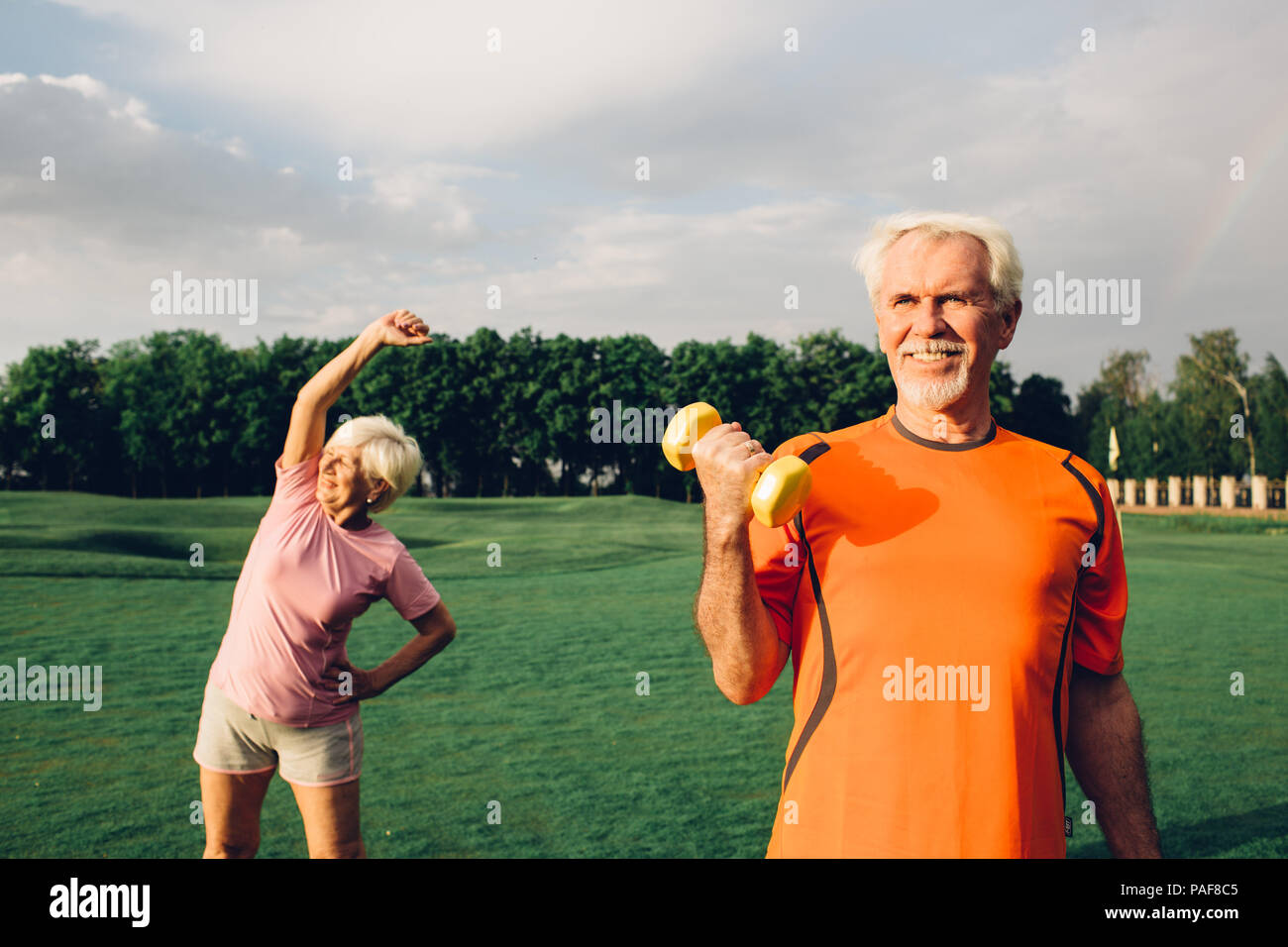 Healthy well being senior people working out with dumbbells Stock Photo