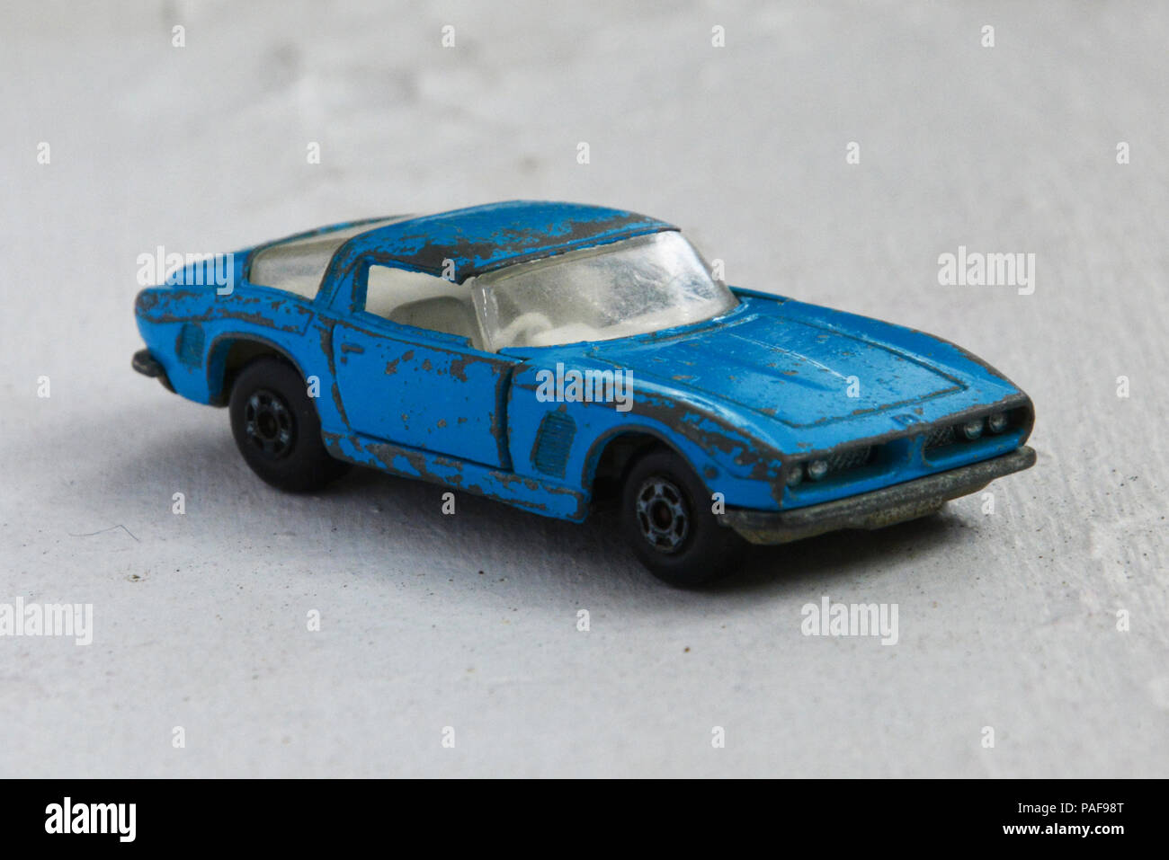 Heavily played with and worn light blue Matchbox No. 14 ISO Grifo toy car Stock Photo