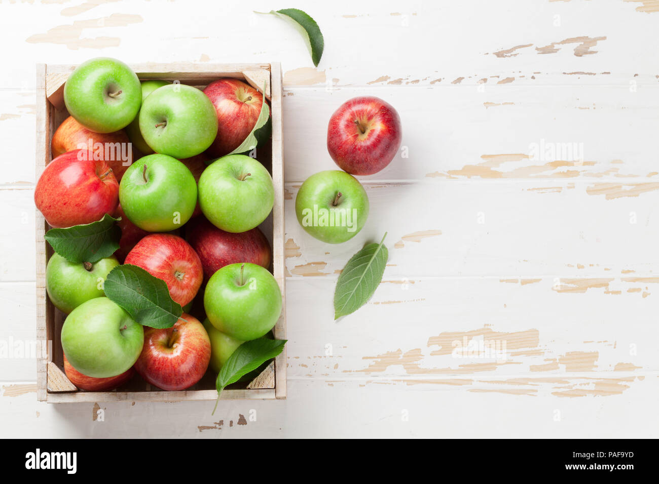 Ripe green and red apples in wooden box. Top view with space for your ...