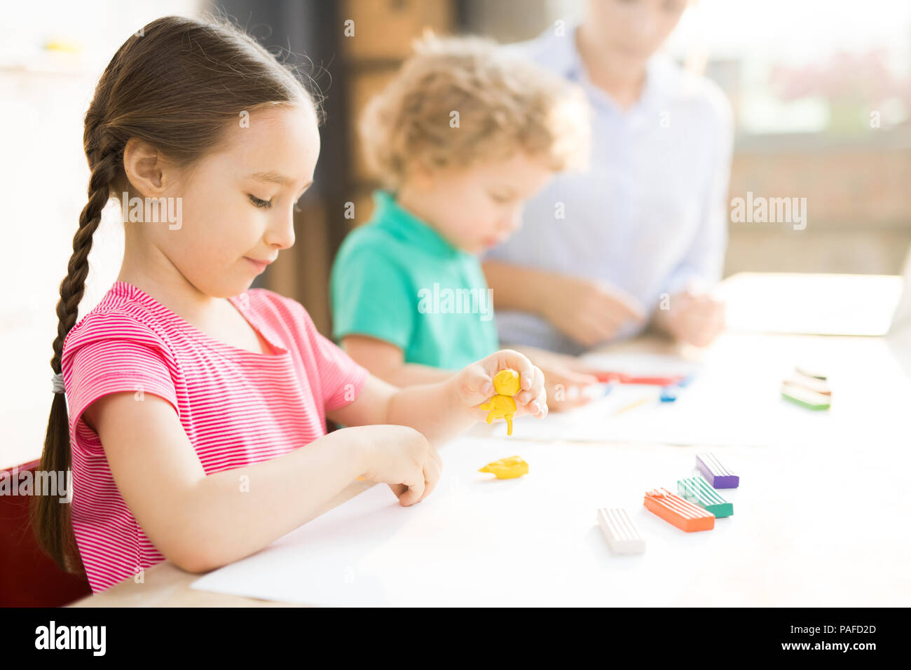 Little girl at art and craft lesson Stock Photo