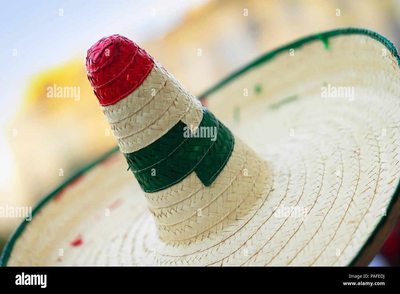 Straw sombrero close-up with red and green decorated, texture Stock