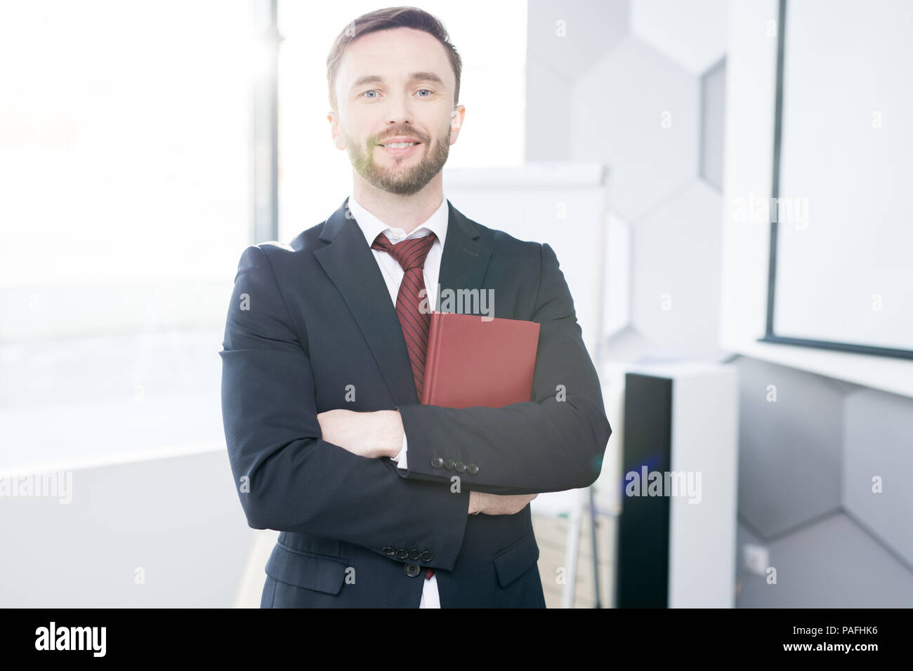 Successful Businessman Posing in Office Stock Photo