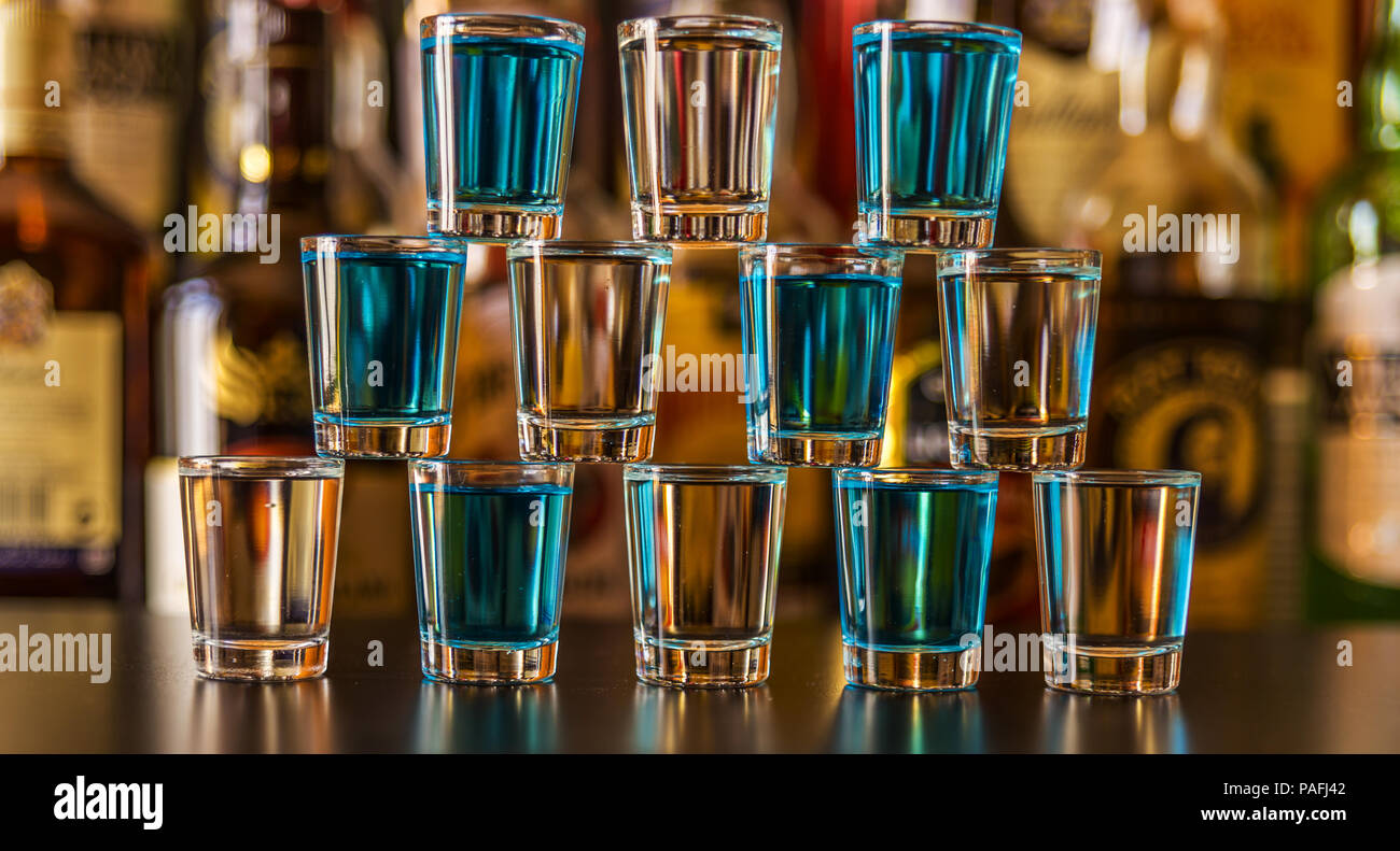 Popular blue drink shot kamikaze on the background of the bar with ...