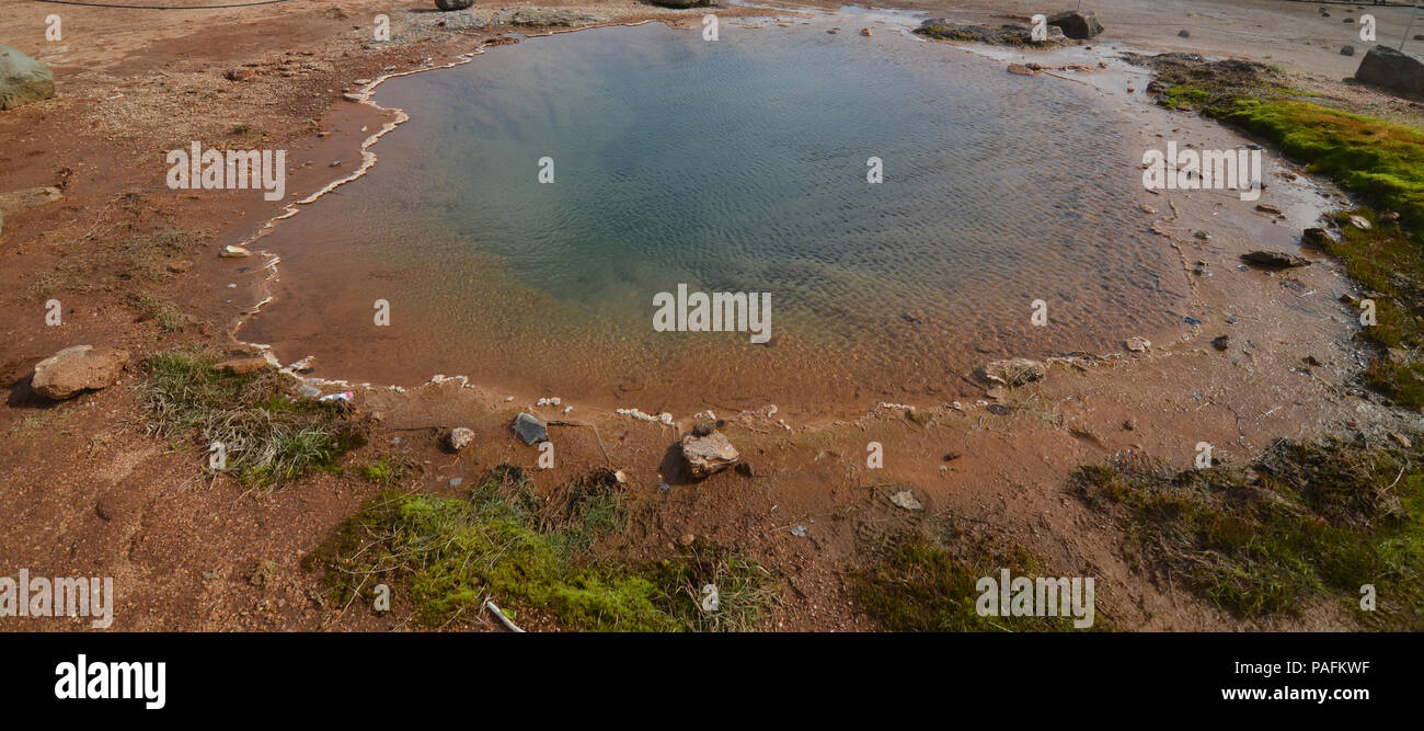 Large hot spring in a field with many mineral depositis in Iceland ...