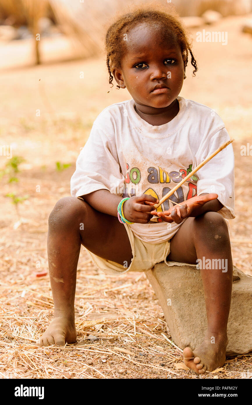 ACCRA, GHANA - MARCH 6, 2012: Unidentified Ghanaian girl with pigtails