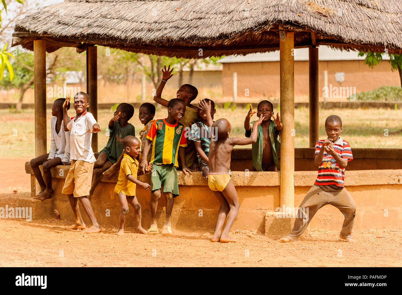 ACCRA, GHANA - MARCH 6, 2012: Unidentified Ghanaian children play and  pose for the camera in the street in Ghana. Children of Ghana suffer of poverty Stock Photo