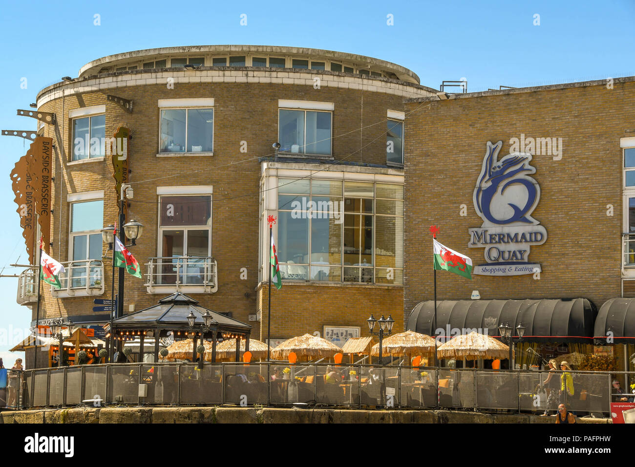 Outdoor seating at a restaurant on Mermaid Quay in Cardiff Bay Stock