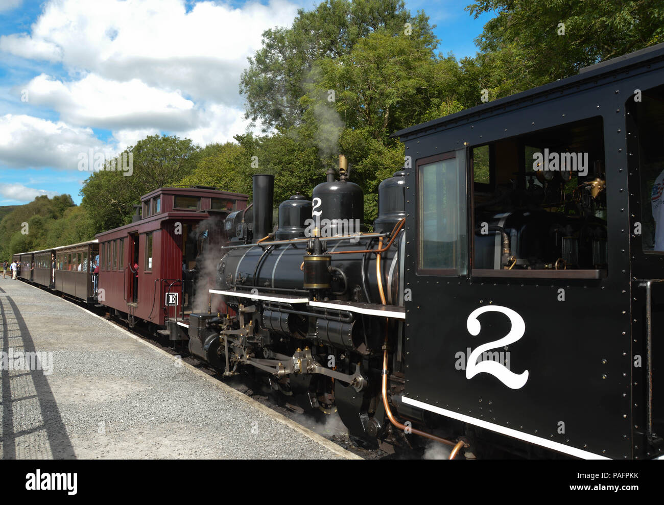 Steam train pulling passenger coaches hi-res stock photography and ...