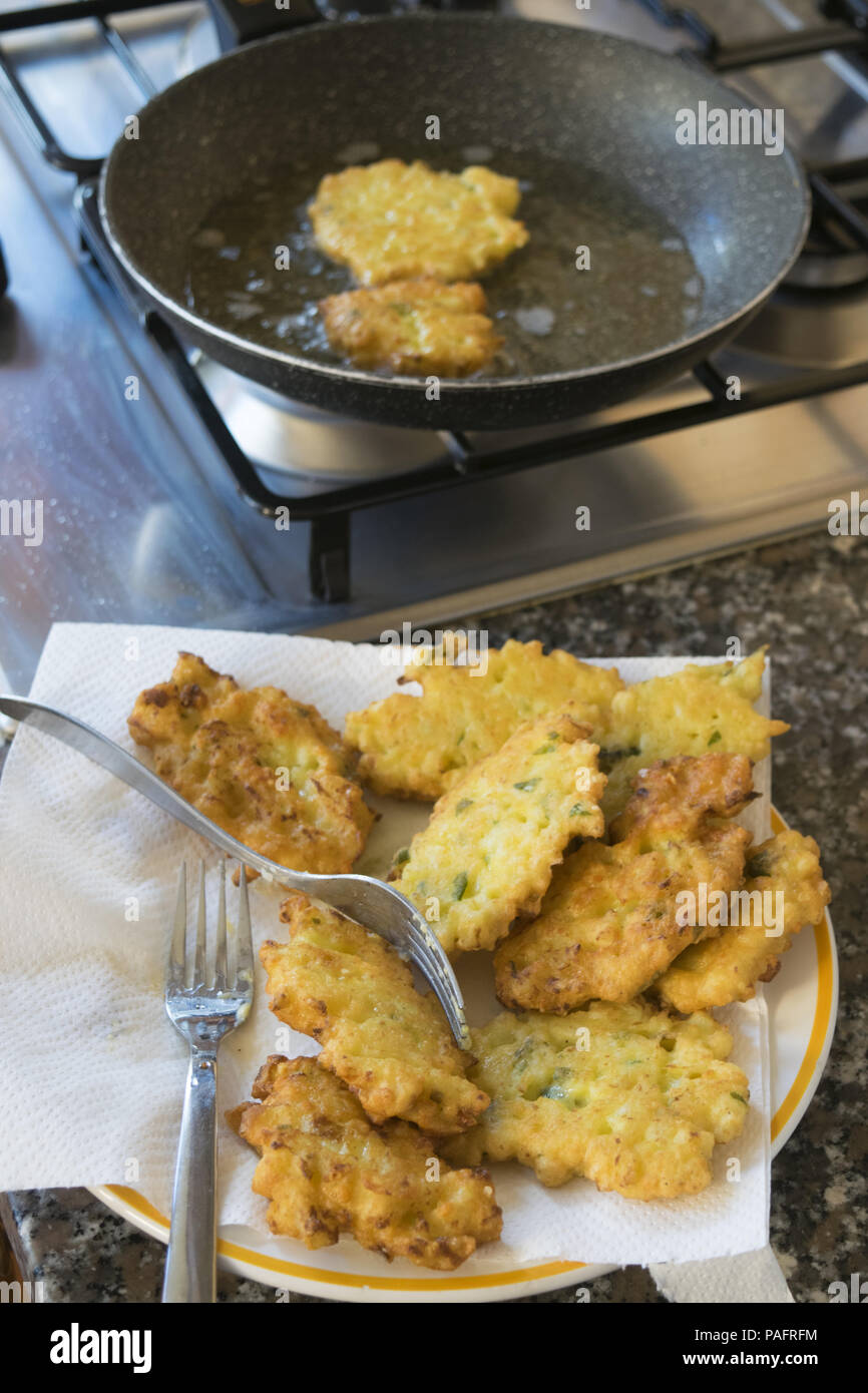 fried zucchini fritter on wooden background Stock Photo