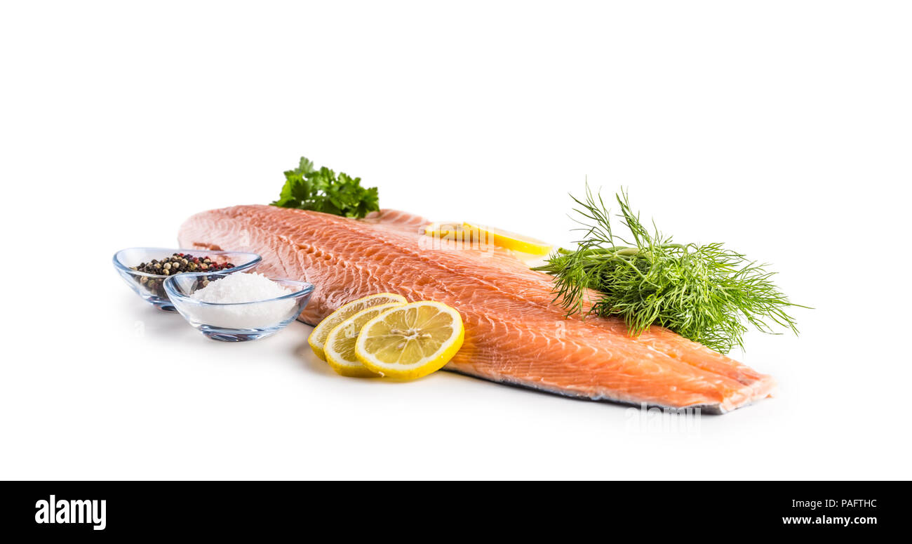 Raw salmon fillet with dill lemon salt and pepper isolated on white ...