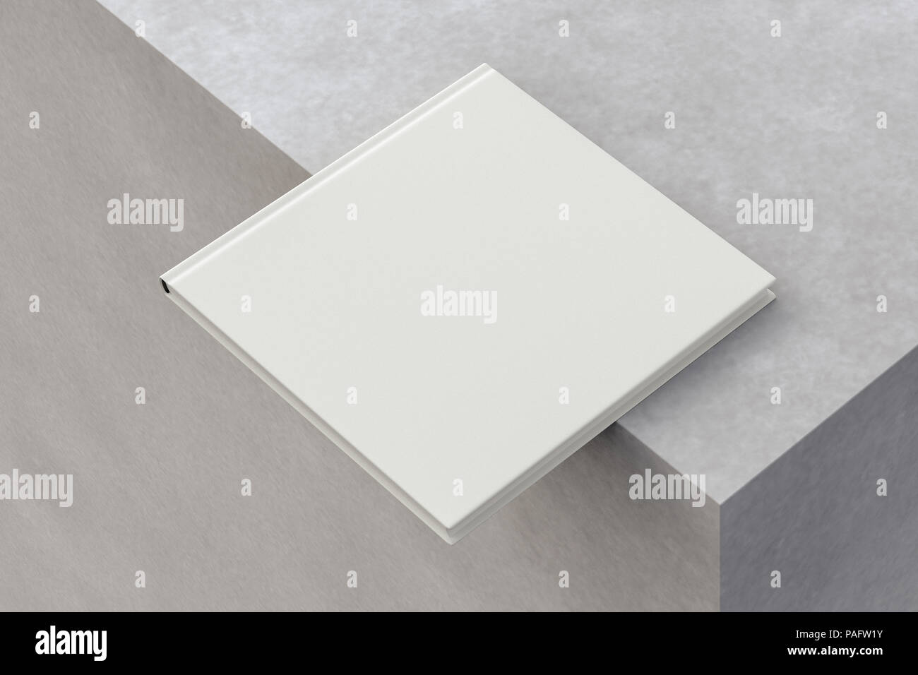 Blank square book on the edge. Isolated with clipping path around book ...
