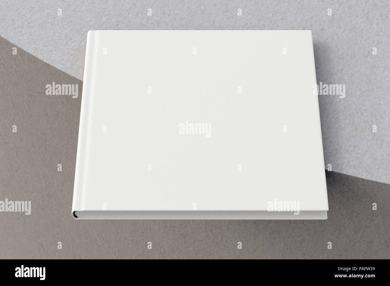 Blank square book on the edge. Isolated with clipping path around book ...
