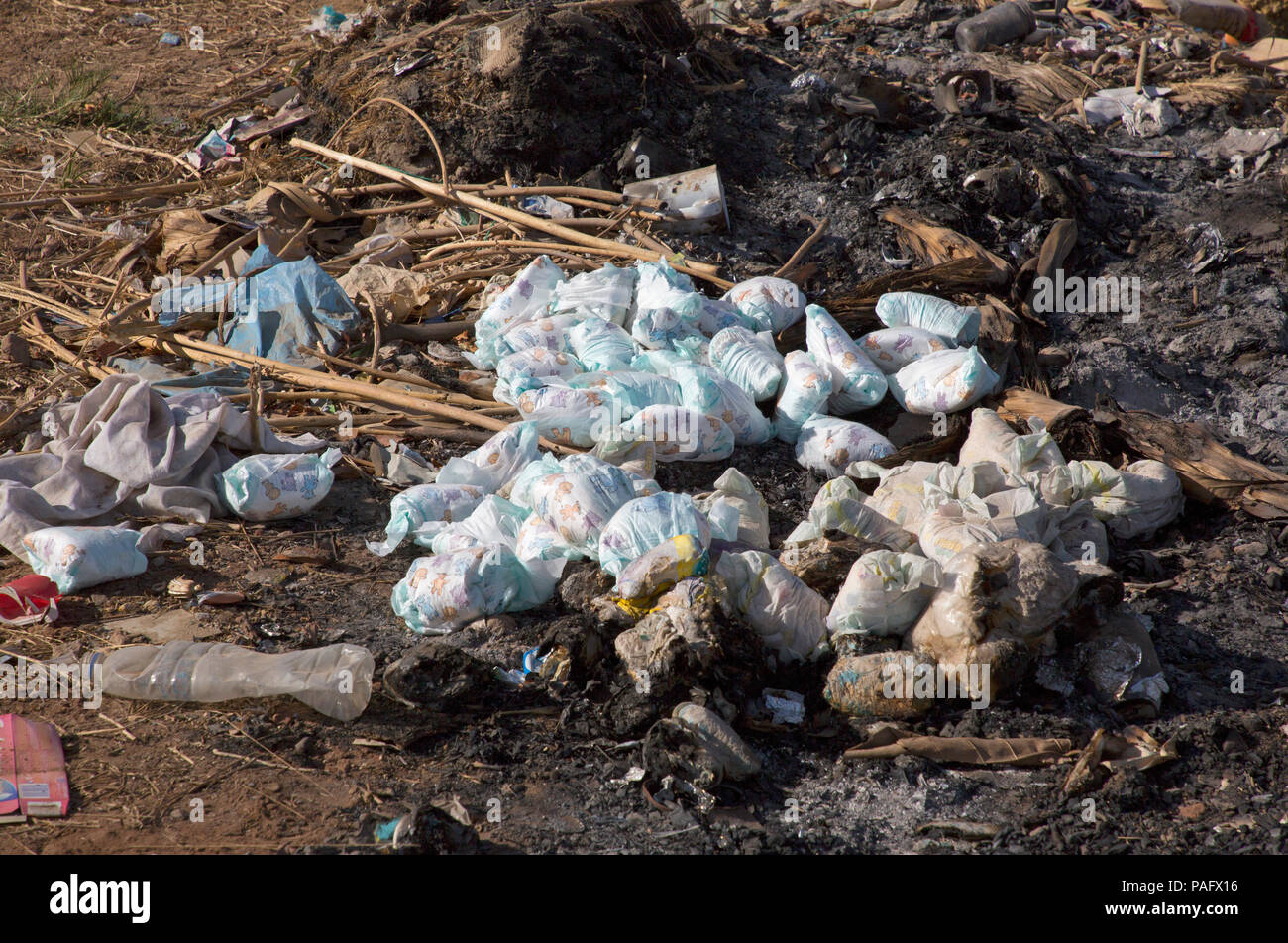 Pile of discarded babies' nappies beside road, The Gambia Stock Photo ...