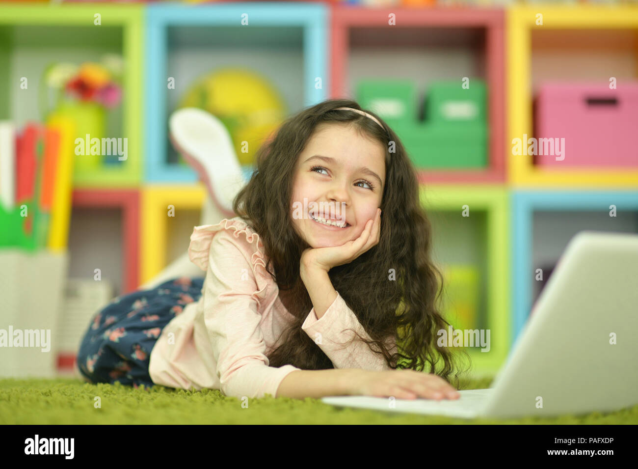 Emotional cute girl using laptop Stock Photo - Alamy