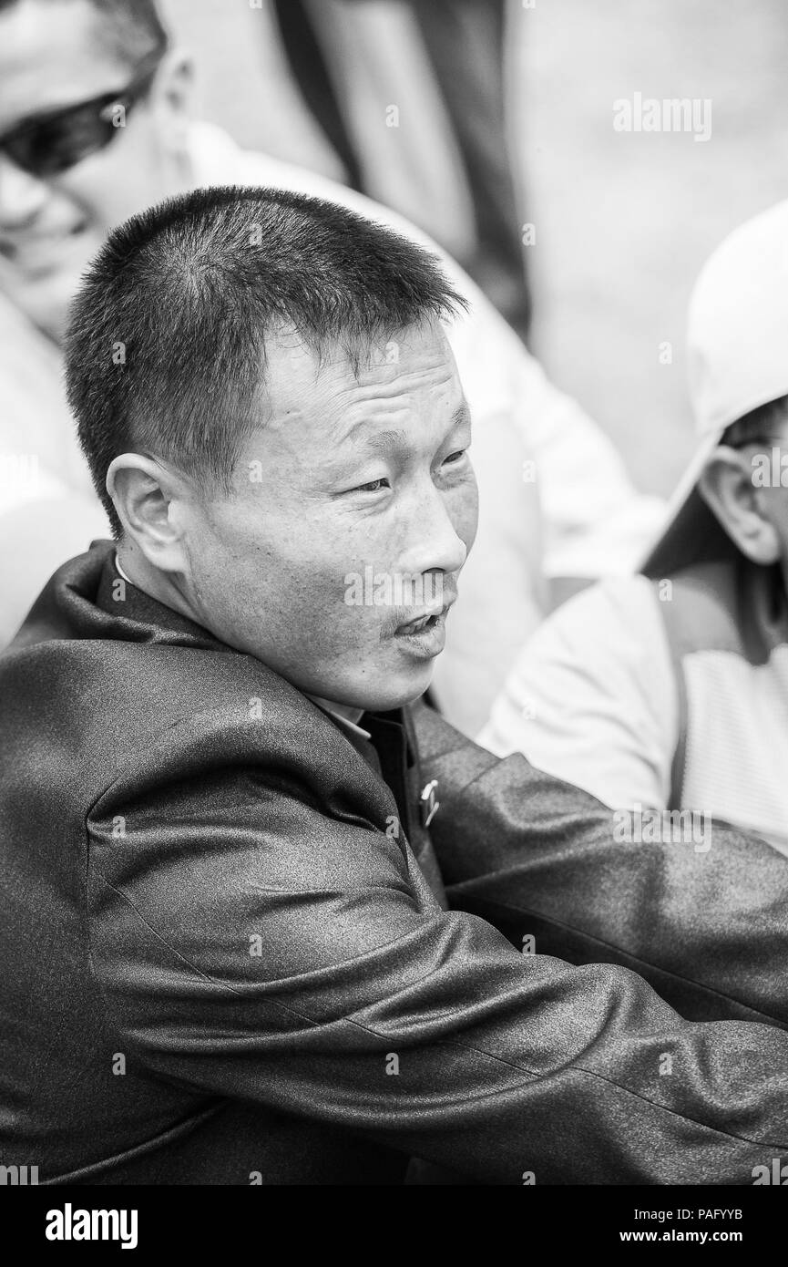 NORTH KOREA MAY 1, 2012 Korean man emotionally participates in the