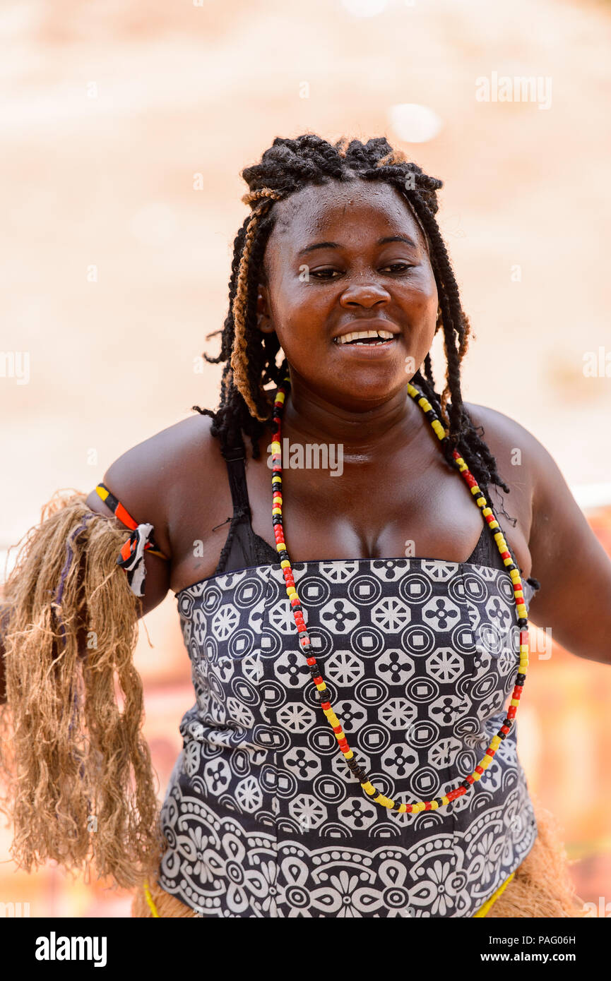 ANGOLA, LUANDA - MARCH 4, 2013: Angolan sympathic woman dances the