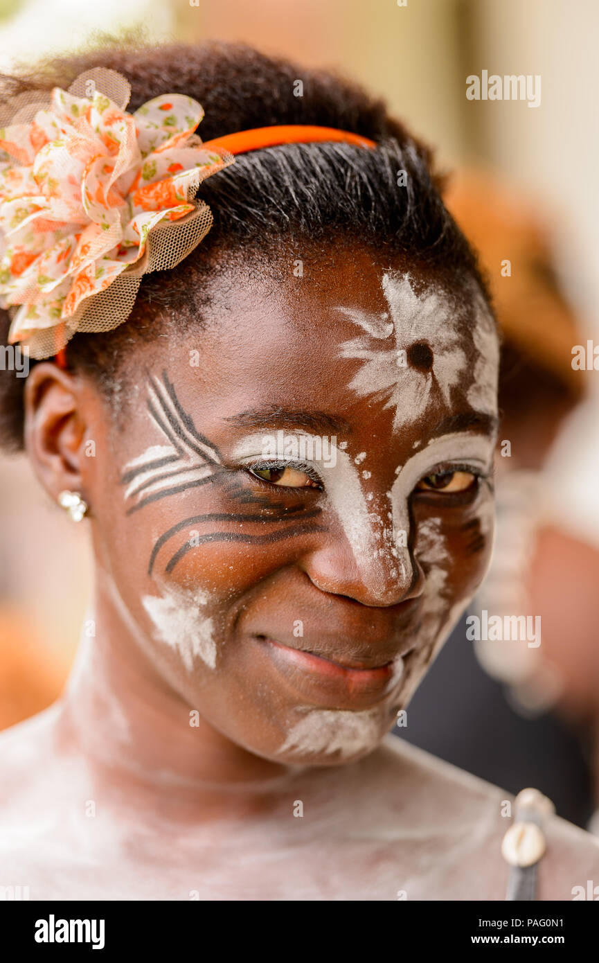 GABON - MARCH 6, 2013: Portrait of an unidentified Gabonese girl with the white paint drawings on her face in Gabon, Mar 6, 2013. White paint symboliz Stock Photo