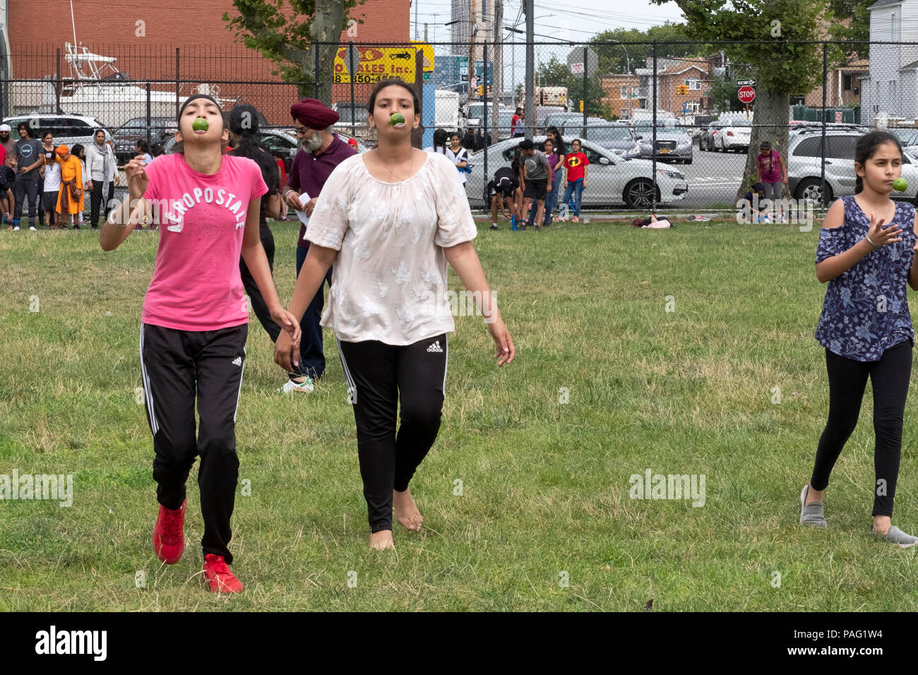 Girls participating in a race where they ran balancing a lime on a