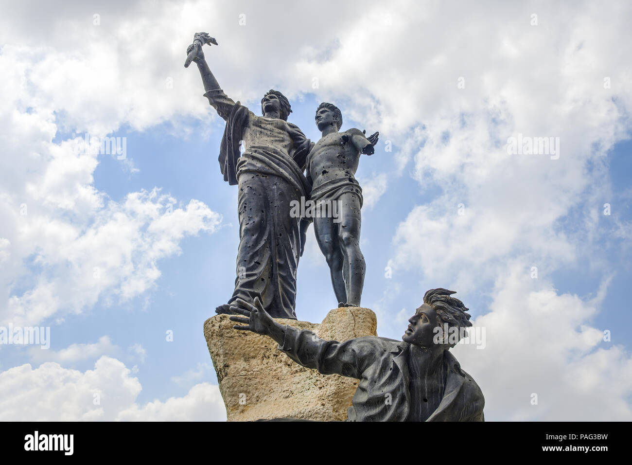 Monument commemorating the martyrs executed by the Ottomans riddled with bullet holes from the Lebanese civil war, Martyrs' square, Beirut, Lebanon Stock Photo