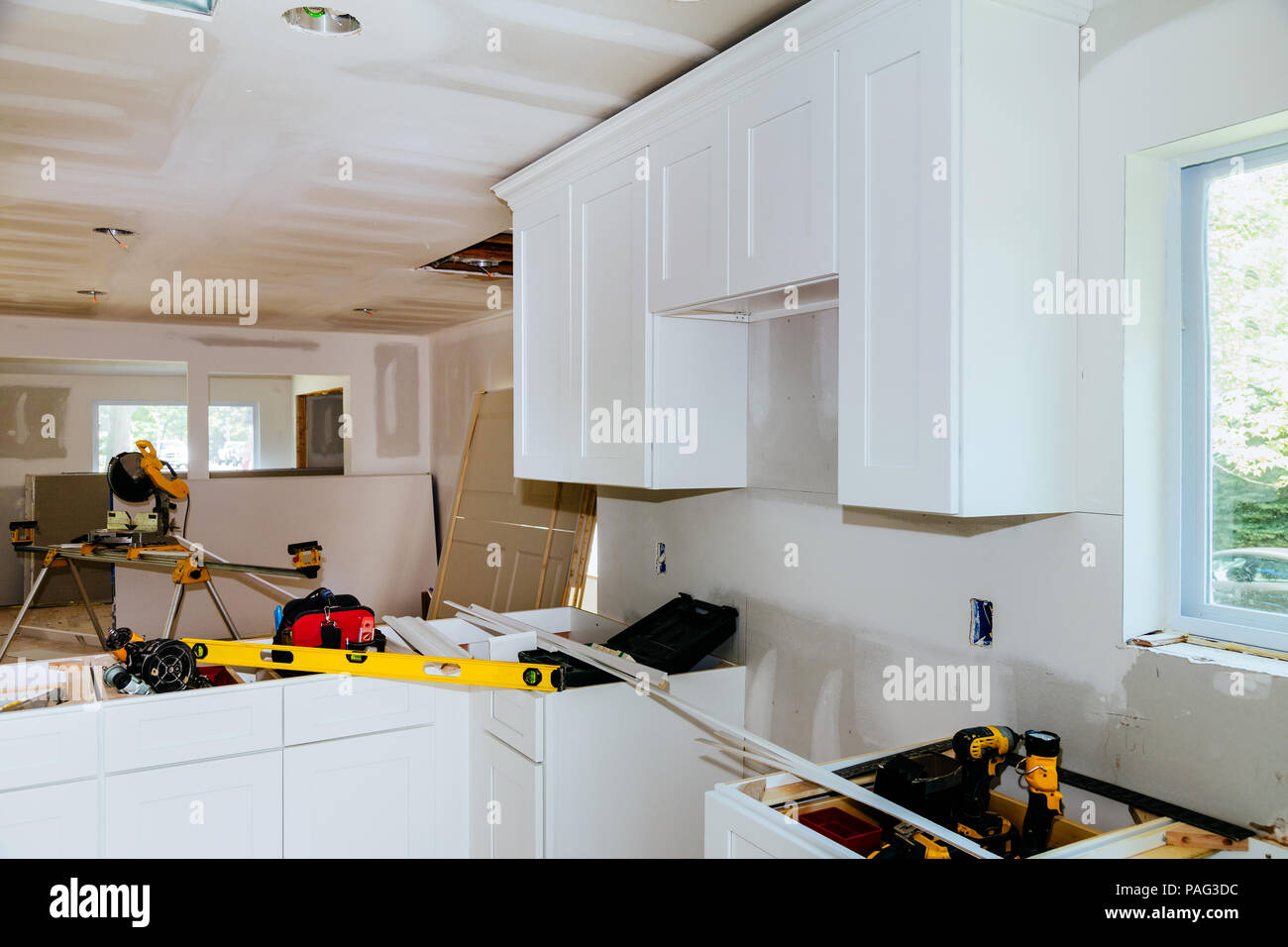 Custom kitchen in various stages of installation base for