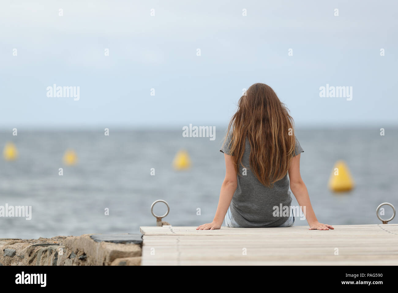 Teenage girl and sad and rear view hi-res stock photography and images ...