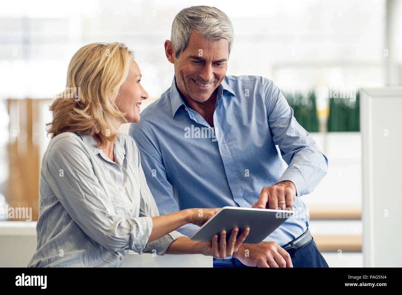 Businesspeople using digital tablet Stock Photo