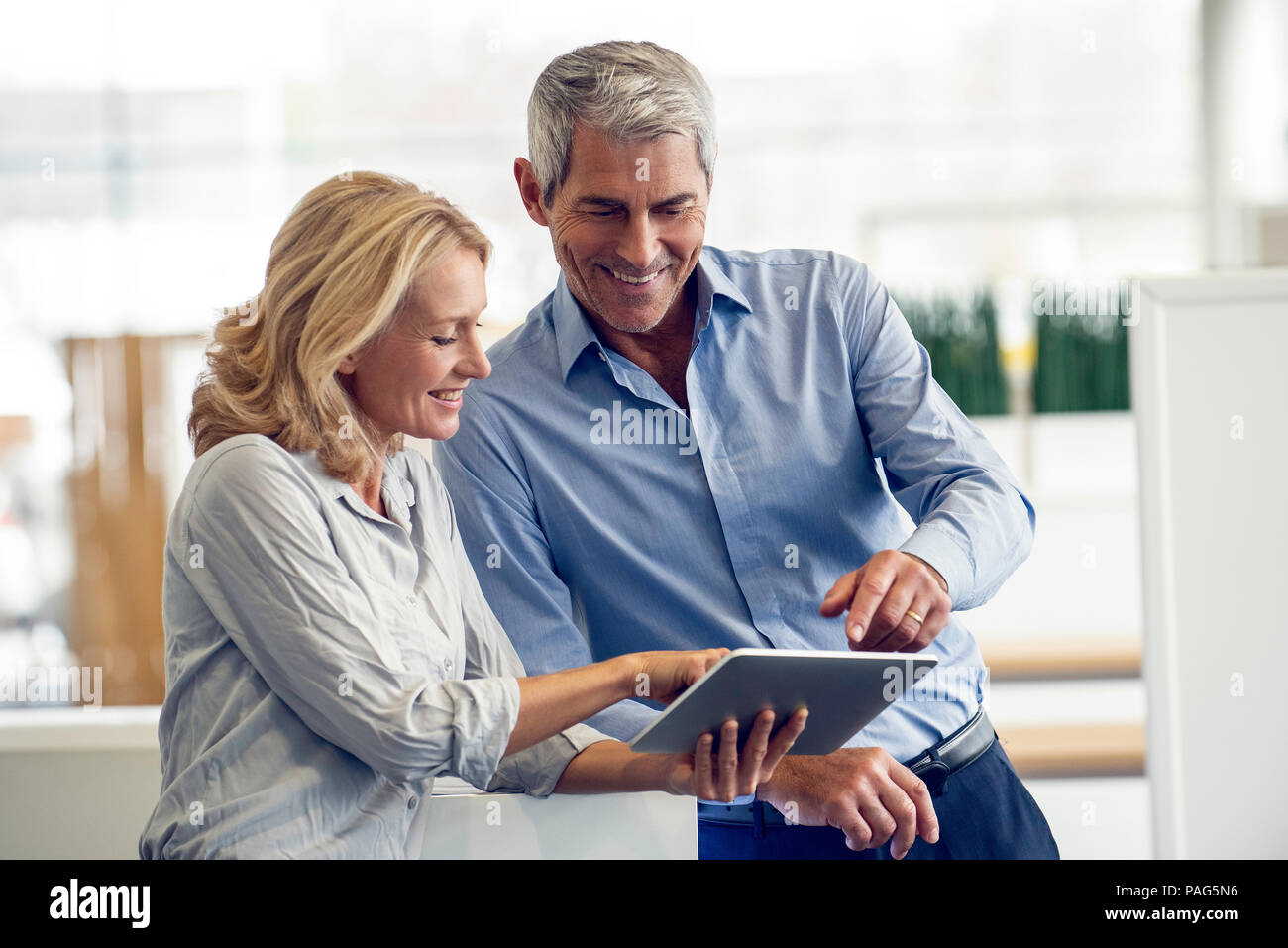 Businesspeople using digital tablet Stock Photo