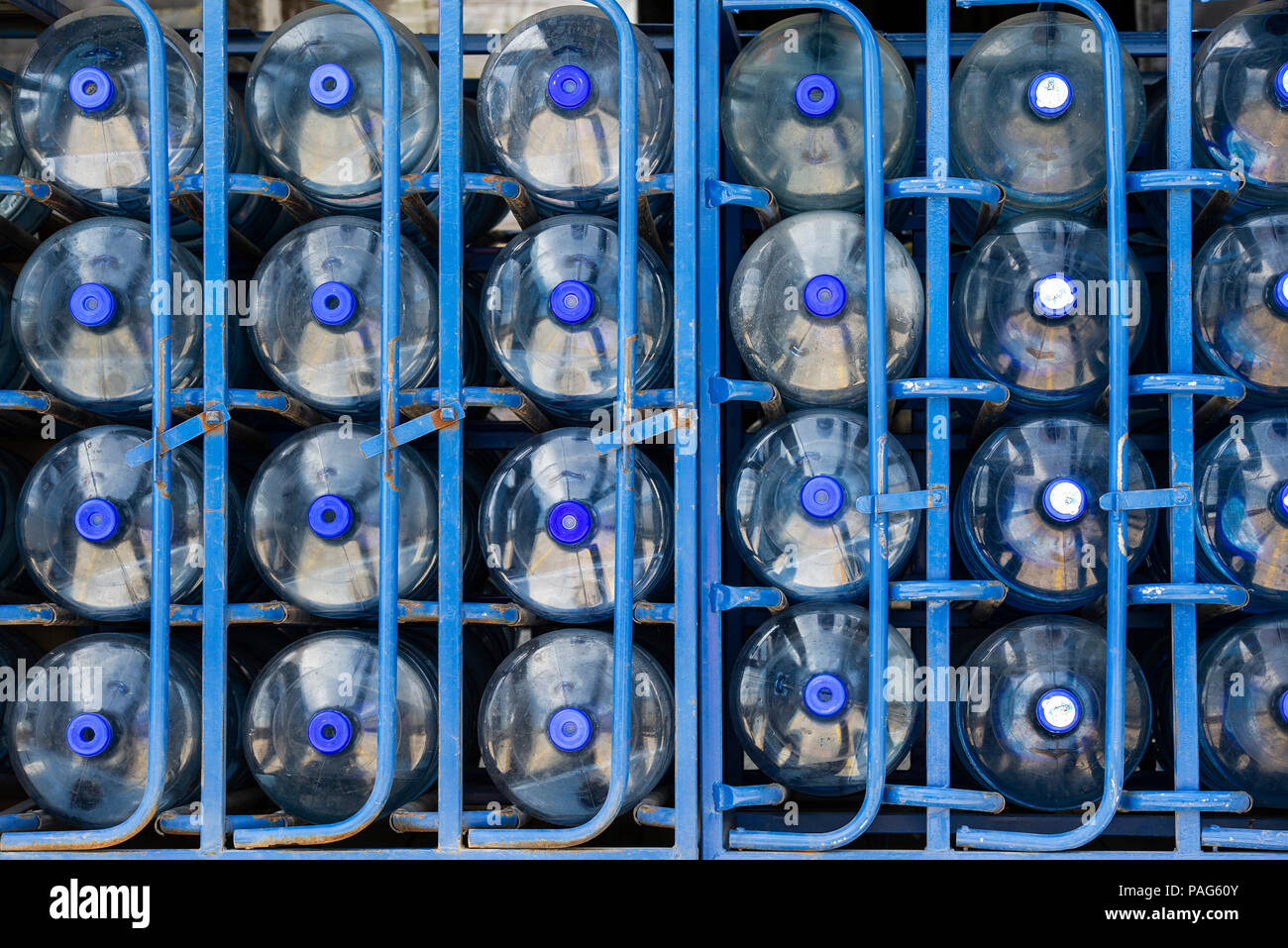Rows of water bottles arranged in warehouse Stock Photo