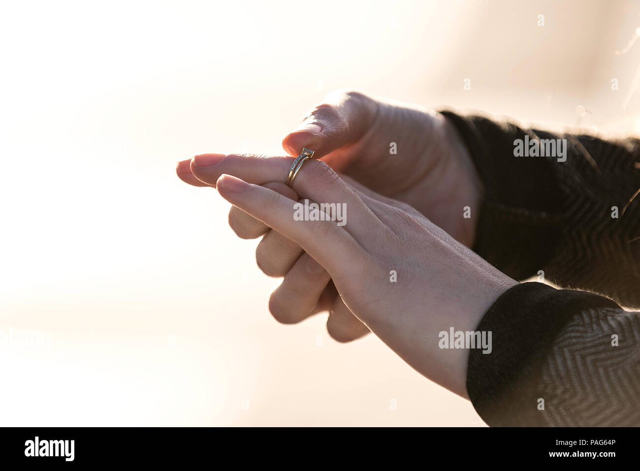 Woman's hand wearing diamond ring Stock Photo Alamy