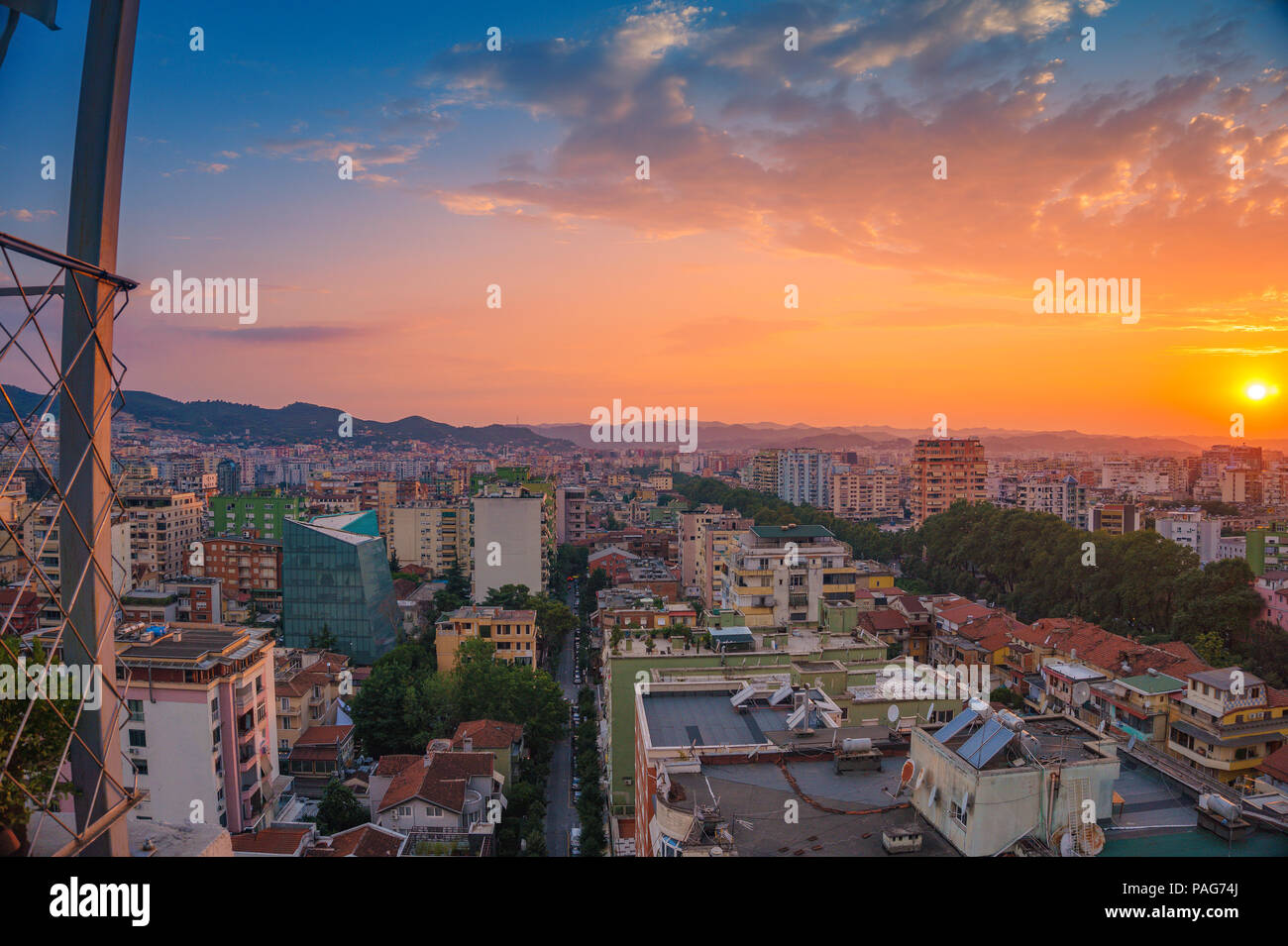 Areal cityscape view of Tirana city center at sunset. Modern Architectural buildings and urban
