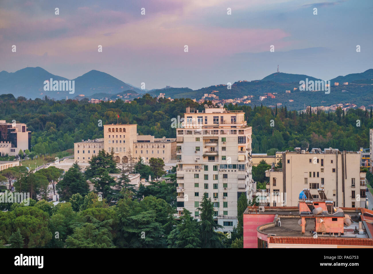 Areal cityscape view of Tirana city center at sunset. Modern Architectural buildings and urban