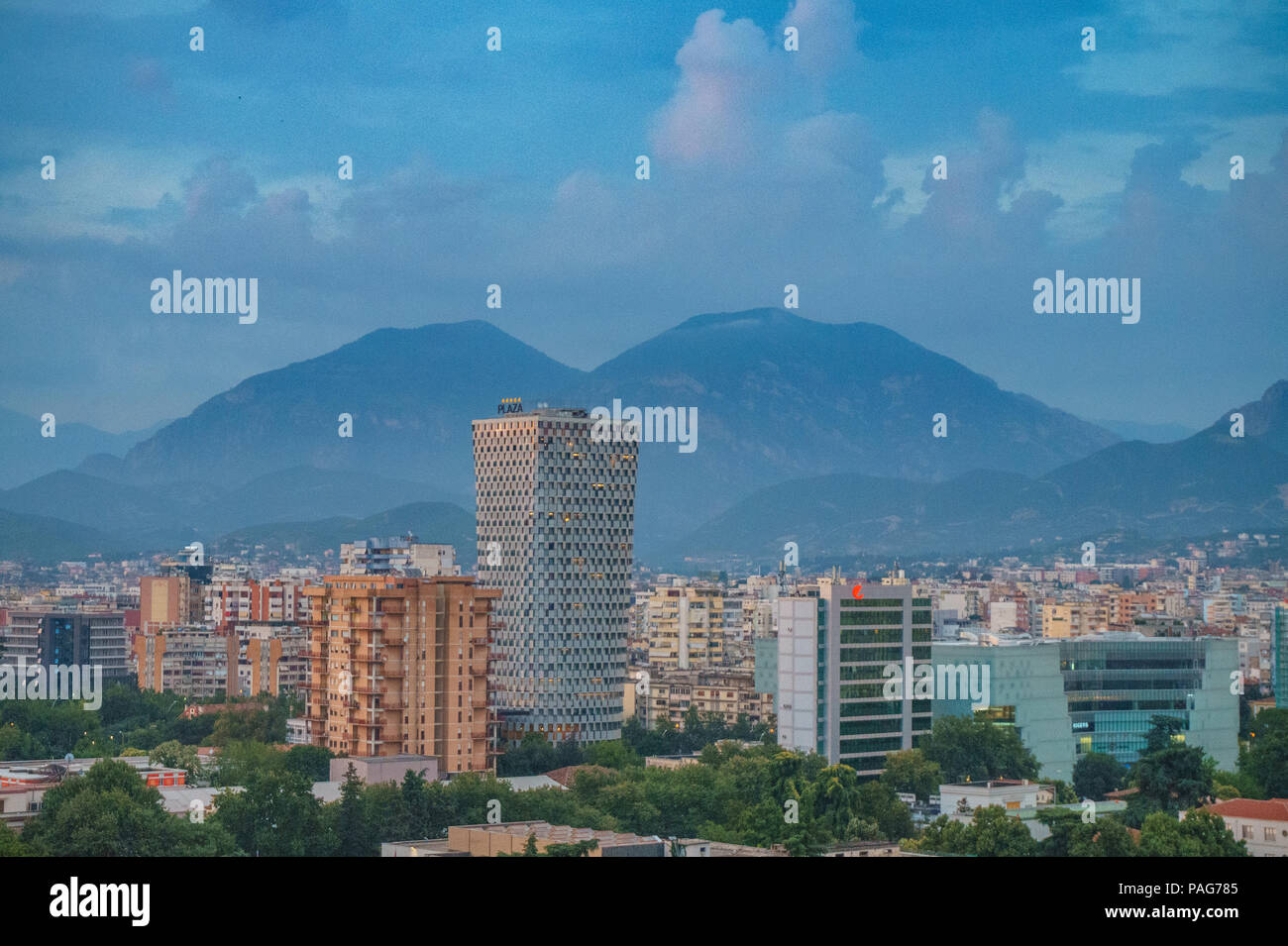 Areal cityscape view of Tirana city center at sunset. Modern Architectural buildings and urban