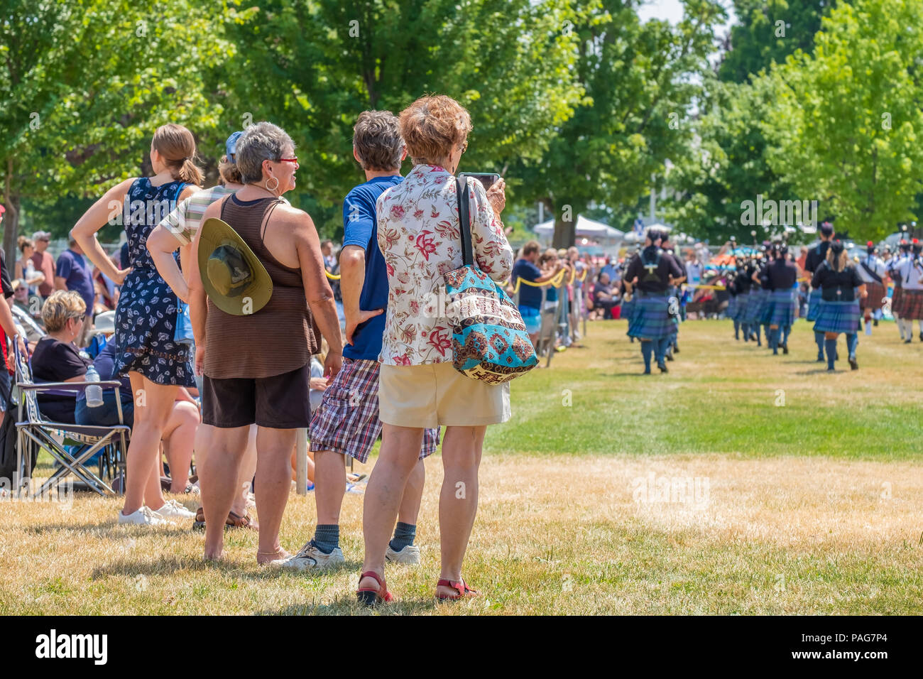 Spectators watch the pipe and drum bands perform at the 41st Annual Scottish Festival in Orillia Ontario. Stock Photo
