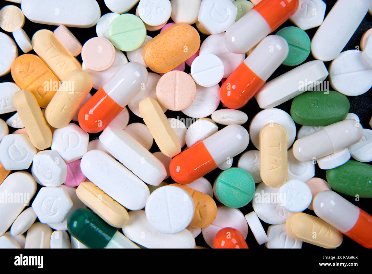 A top view of a heap of colourful medicine pills and capsules Stock Photo