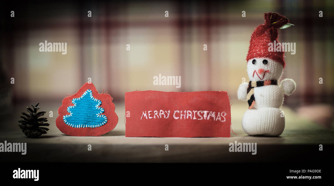 festive background. toy snowman and the words merry Christmas o Stock Photo