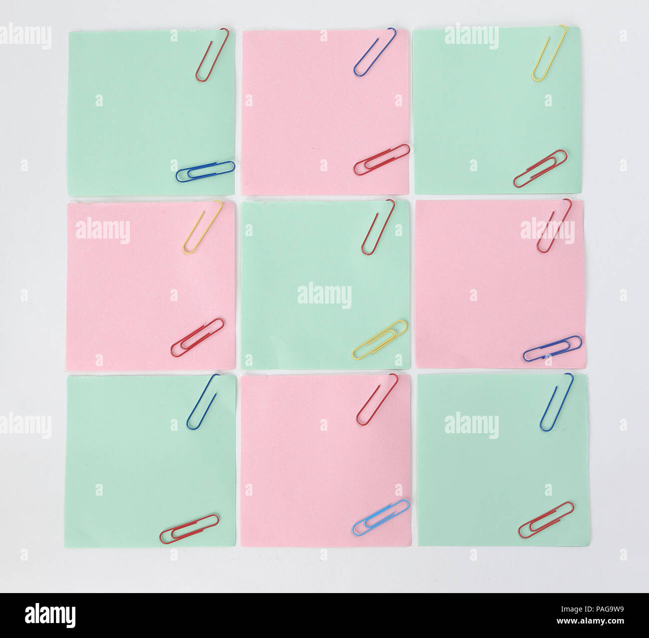 multiple blank sheets for notes with paper clips isolated on whi Stock Photo