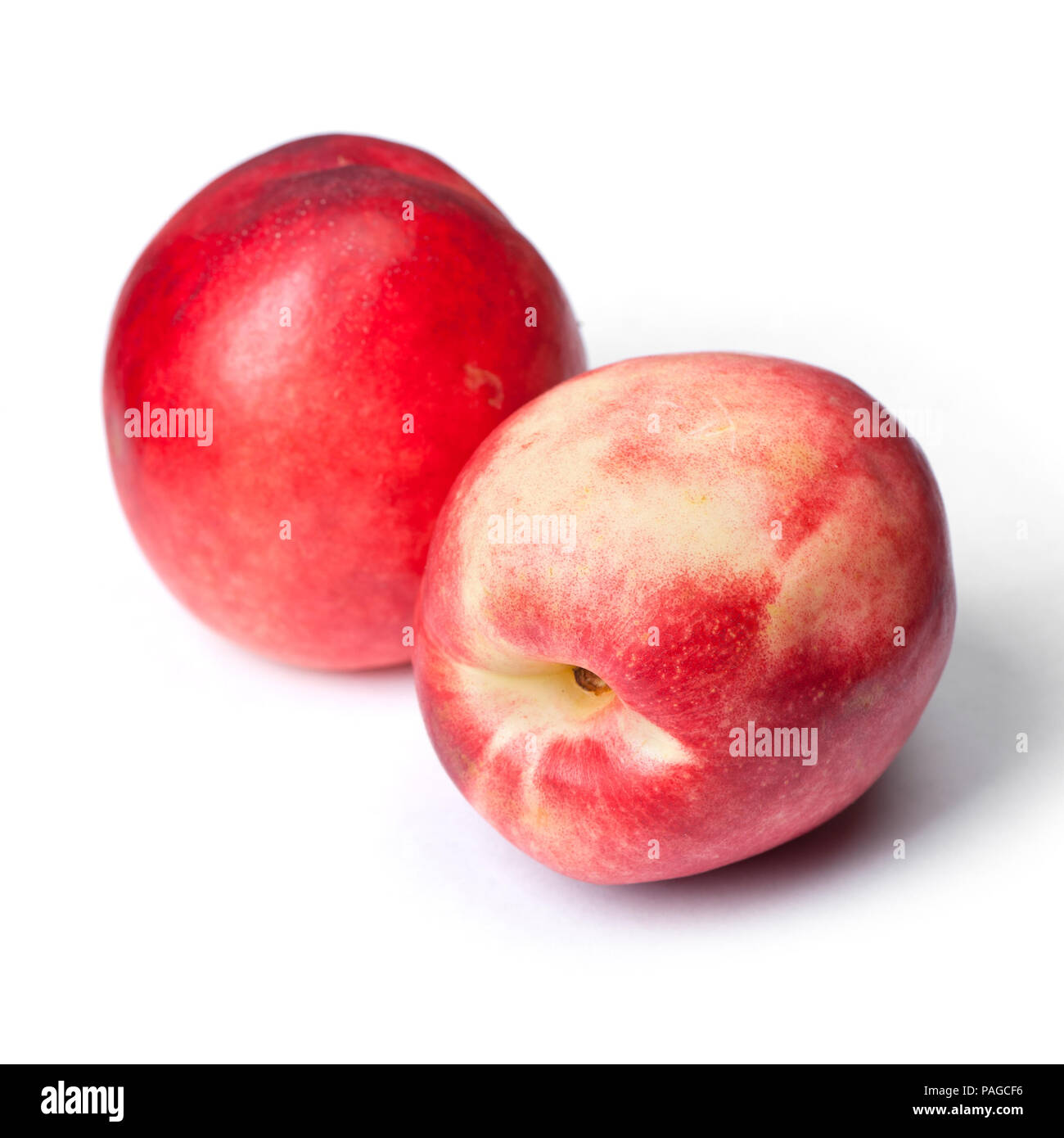 Few tasty nectarines isolated on white background Stock Photo