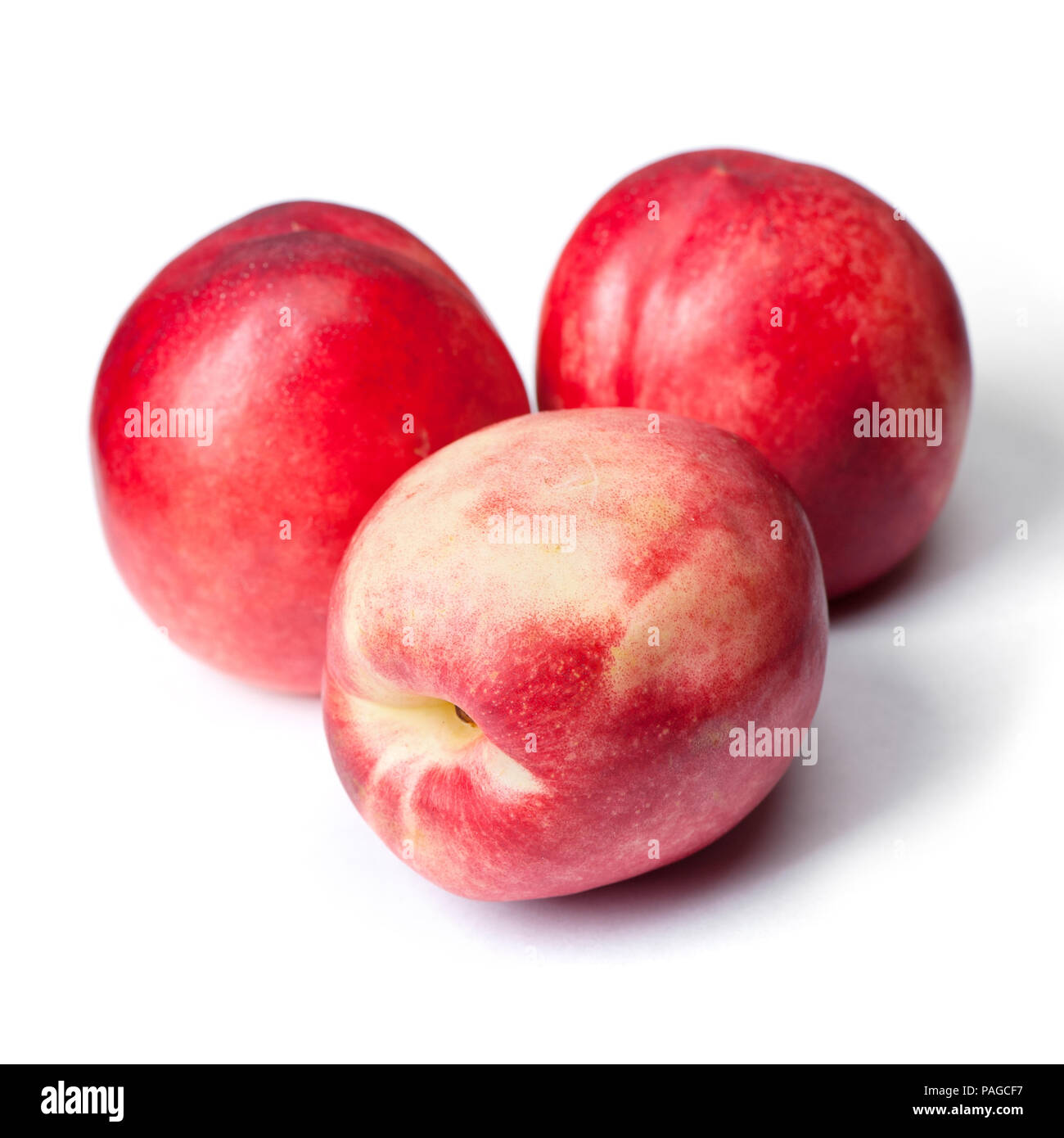 Few tasty nectarines isolated on white background Stock Photo