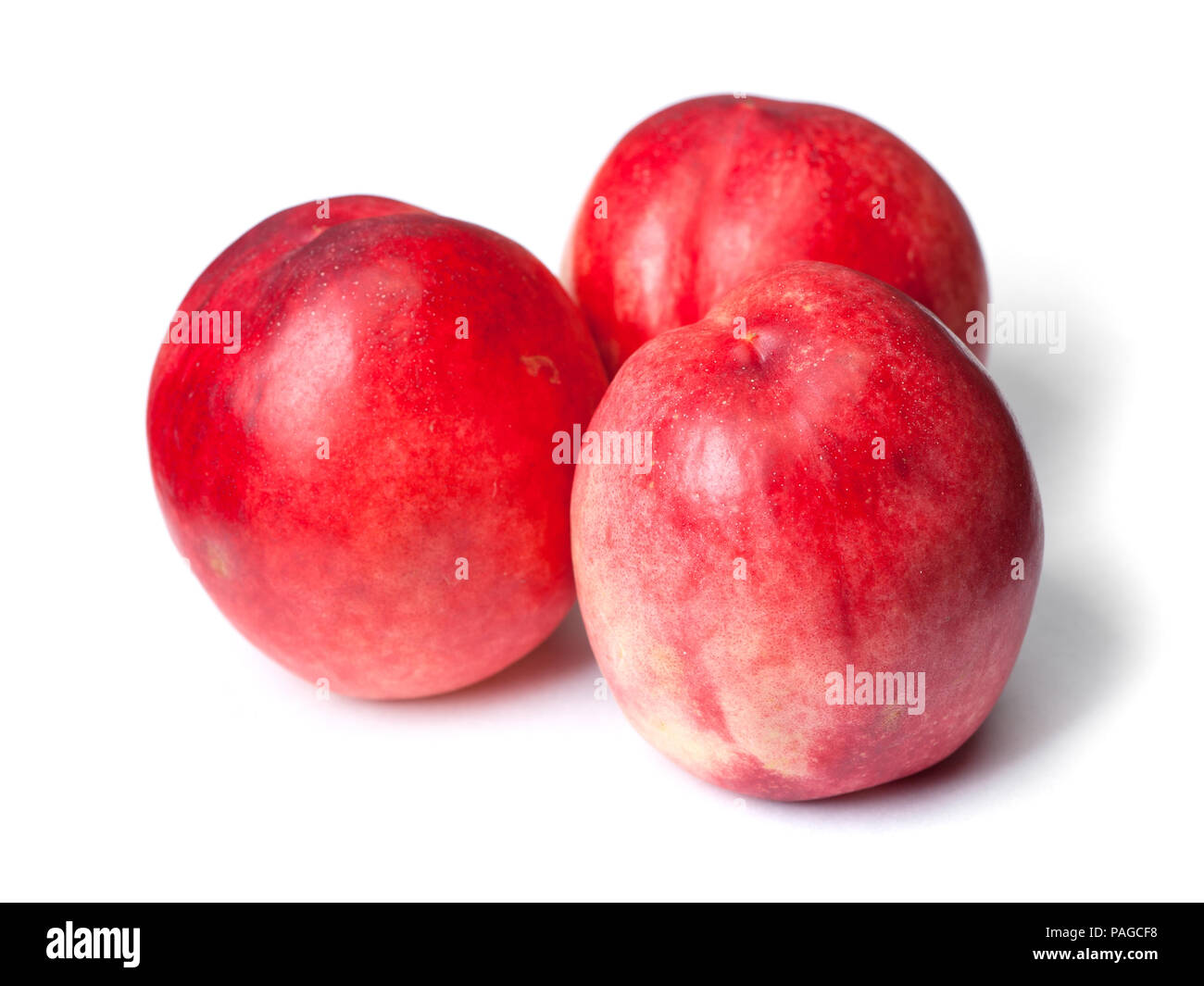 Few tasty nectarines isolated on white background Stock Photo