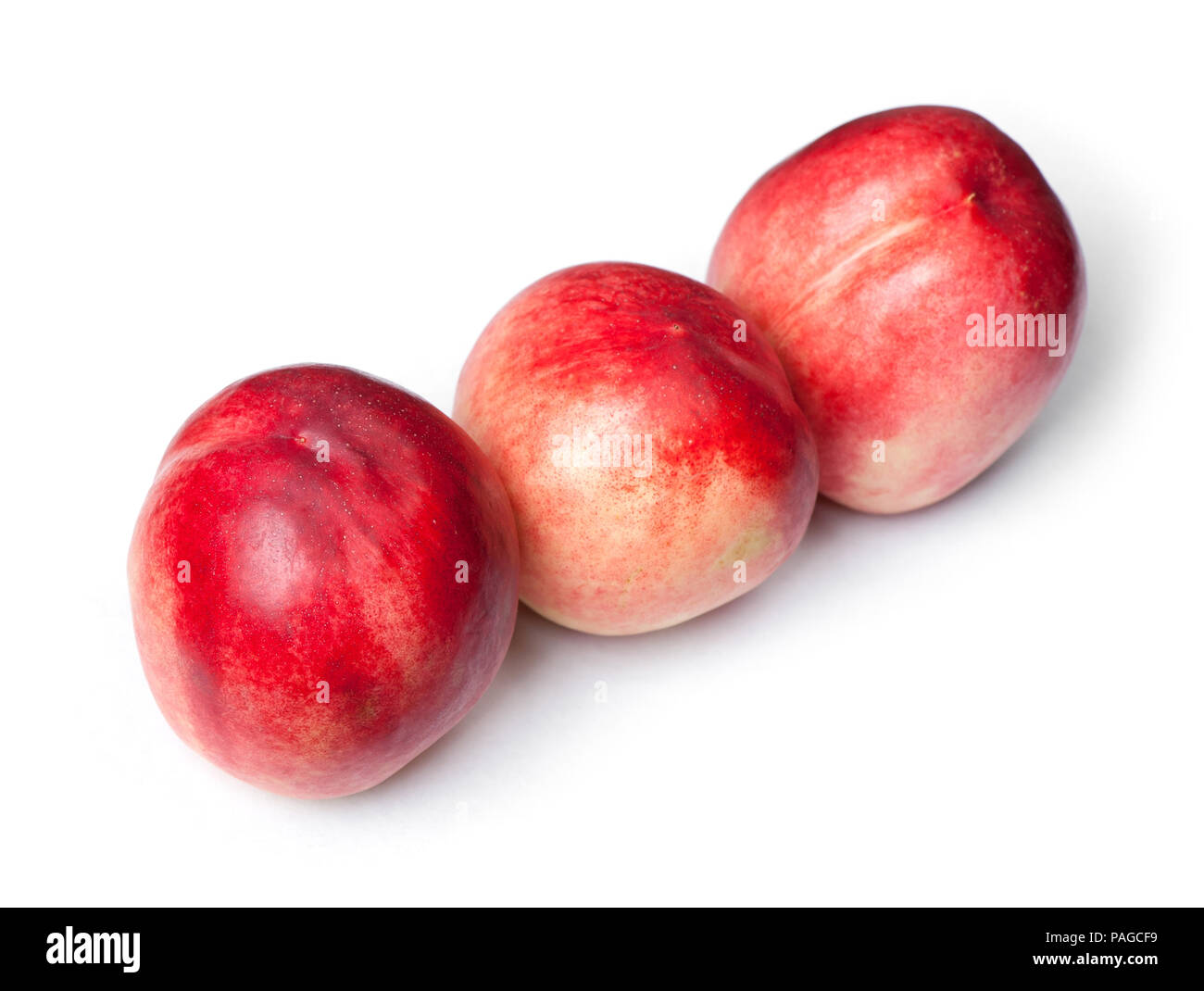Few tasty nectarines isolated on white background Stock Photo