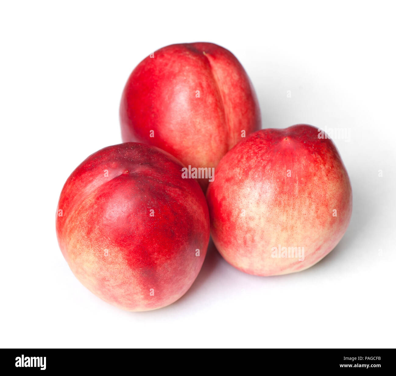 Few tasty nectarines isolated on white background Stock Photo