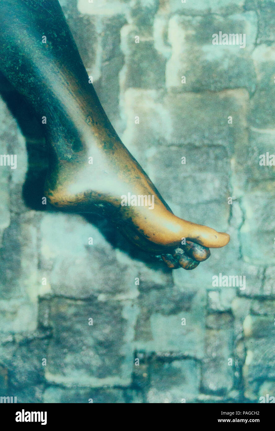 Female bronze foot detail of the door on the cathedral orvieto Stock Photo