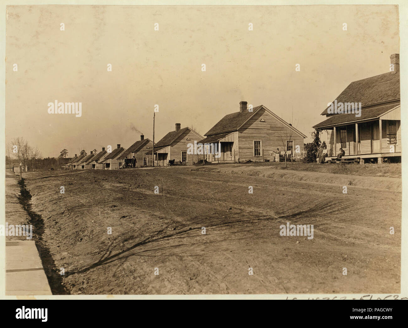 A row of houses of the cotton mill people. Lydia Mills, Clinton, S.C. Witness, Sara R. Hine. Dec. 2, 1908. L.W.H. Stock Photo