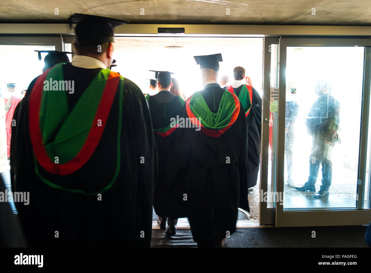 Higher Education in the UK: Students graduating from Aberystwyth university, in their traditional mortar boards and black academic gowns. July 2018 Stock Photo