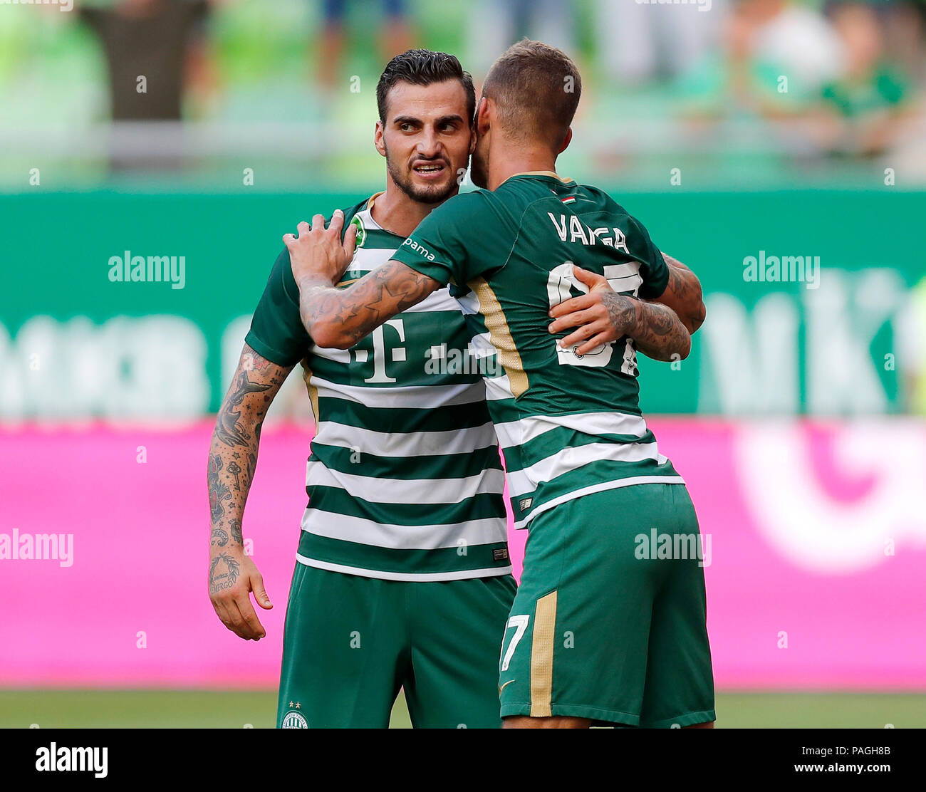 BUDAPEST, HUNGARY - JULY 12: (r-l) Roland Varga of Ferencvarosi TC hugs  goal scorer Stefan