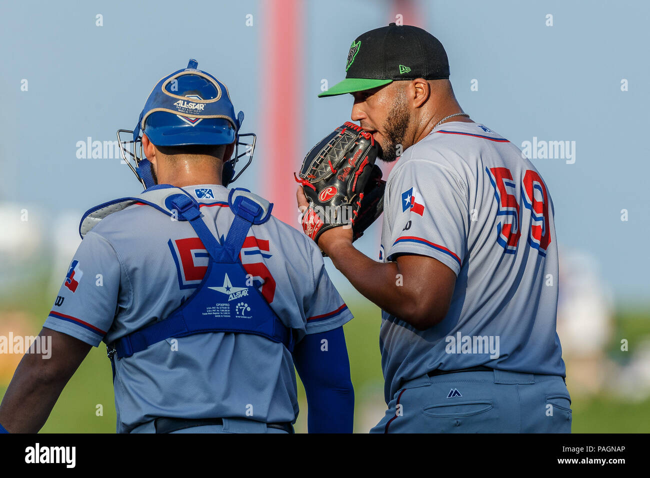 Omaha, NE U.S. 21st July, 2018. Round Rock Express starting pitcher Deolis  Guerra #59 talks with catcher Tony Sanchez #55 during game 3 of the Round  Rock Express (AAA Texas Rangers) and
